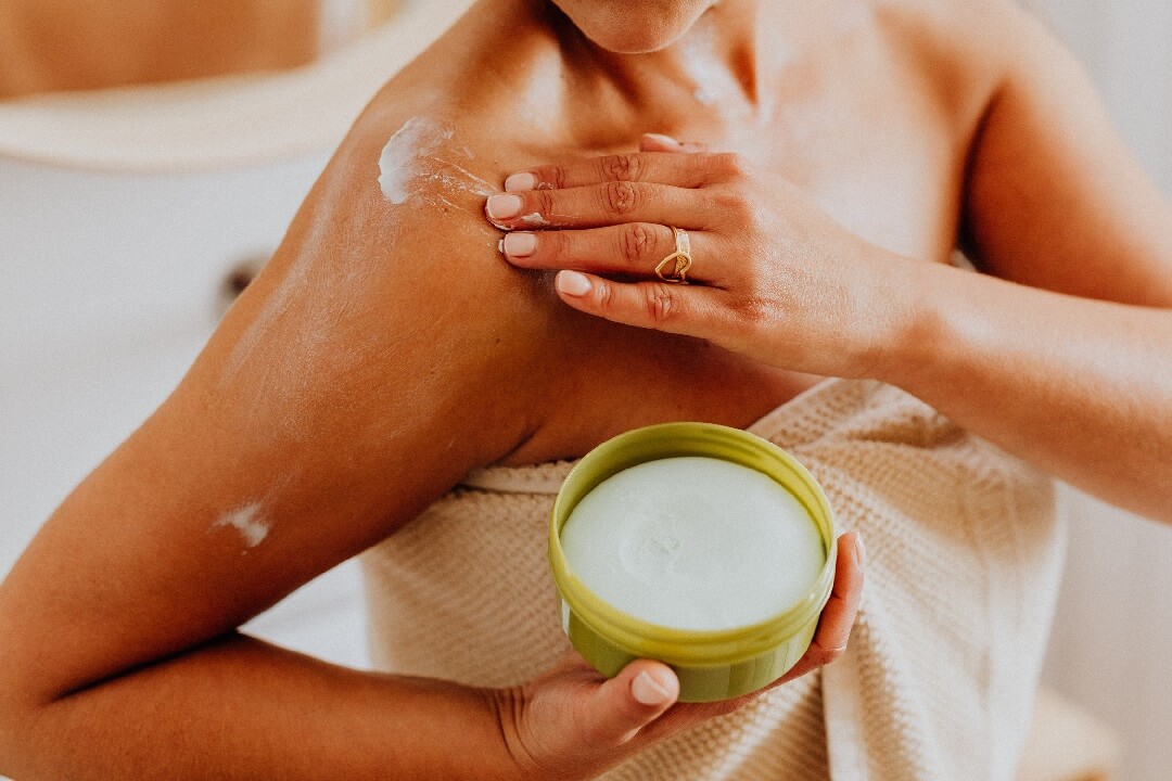 best body butter featured image of woman putting cream on skin