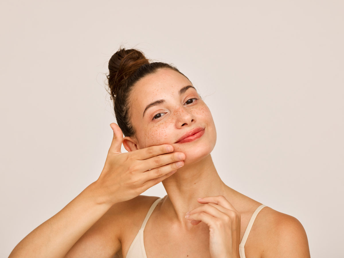woman using skincare products