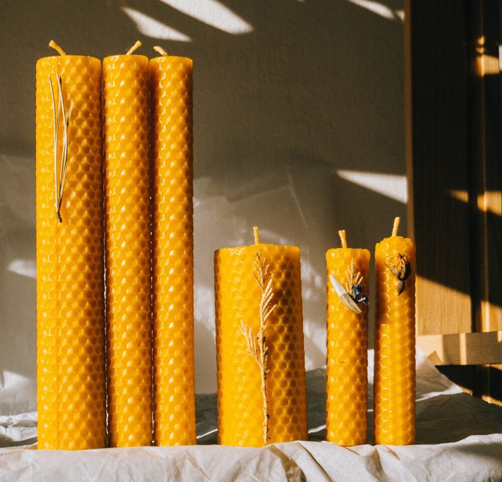 yellow pillar candles on the table