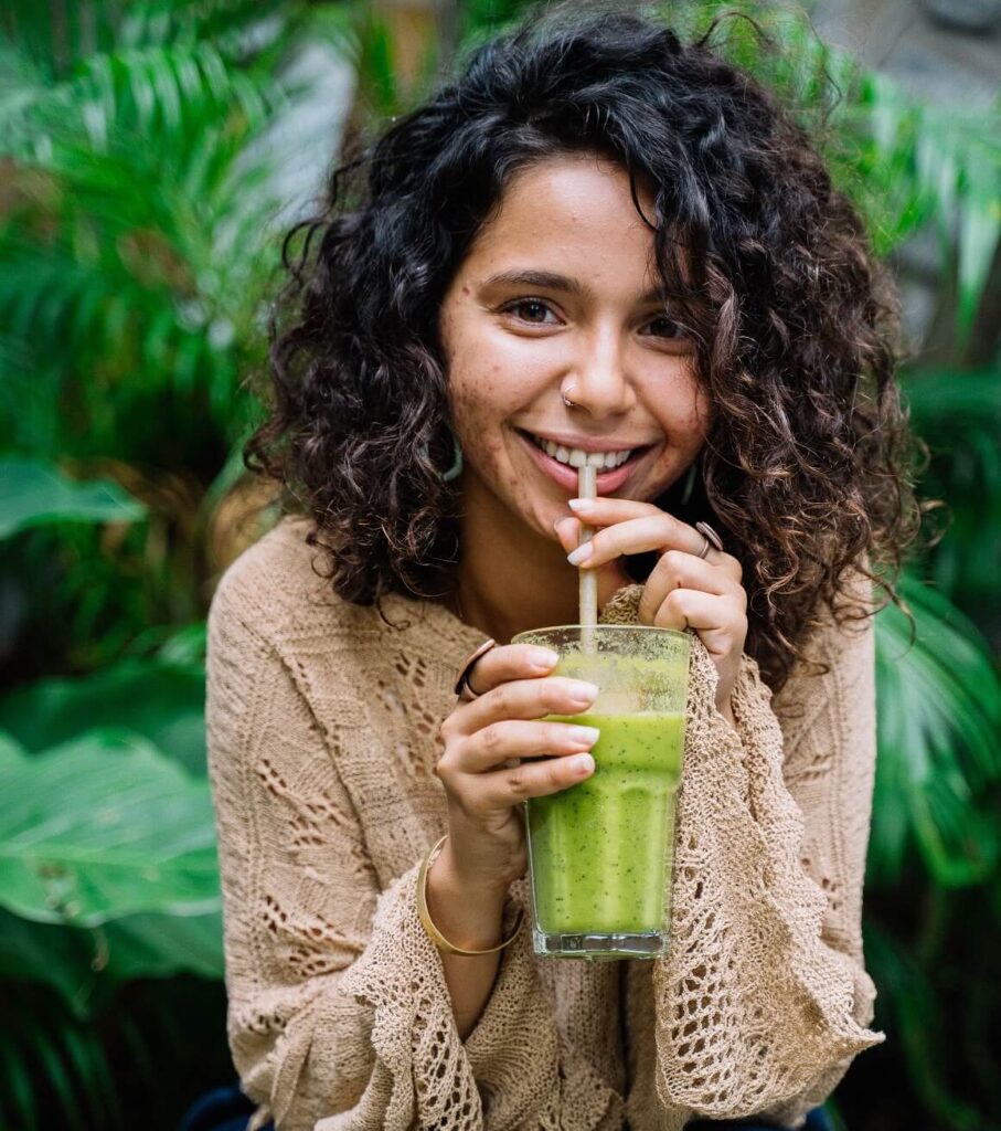Woman sipping a smoothie