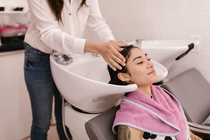 Woman getting her hair washed at the salon